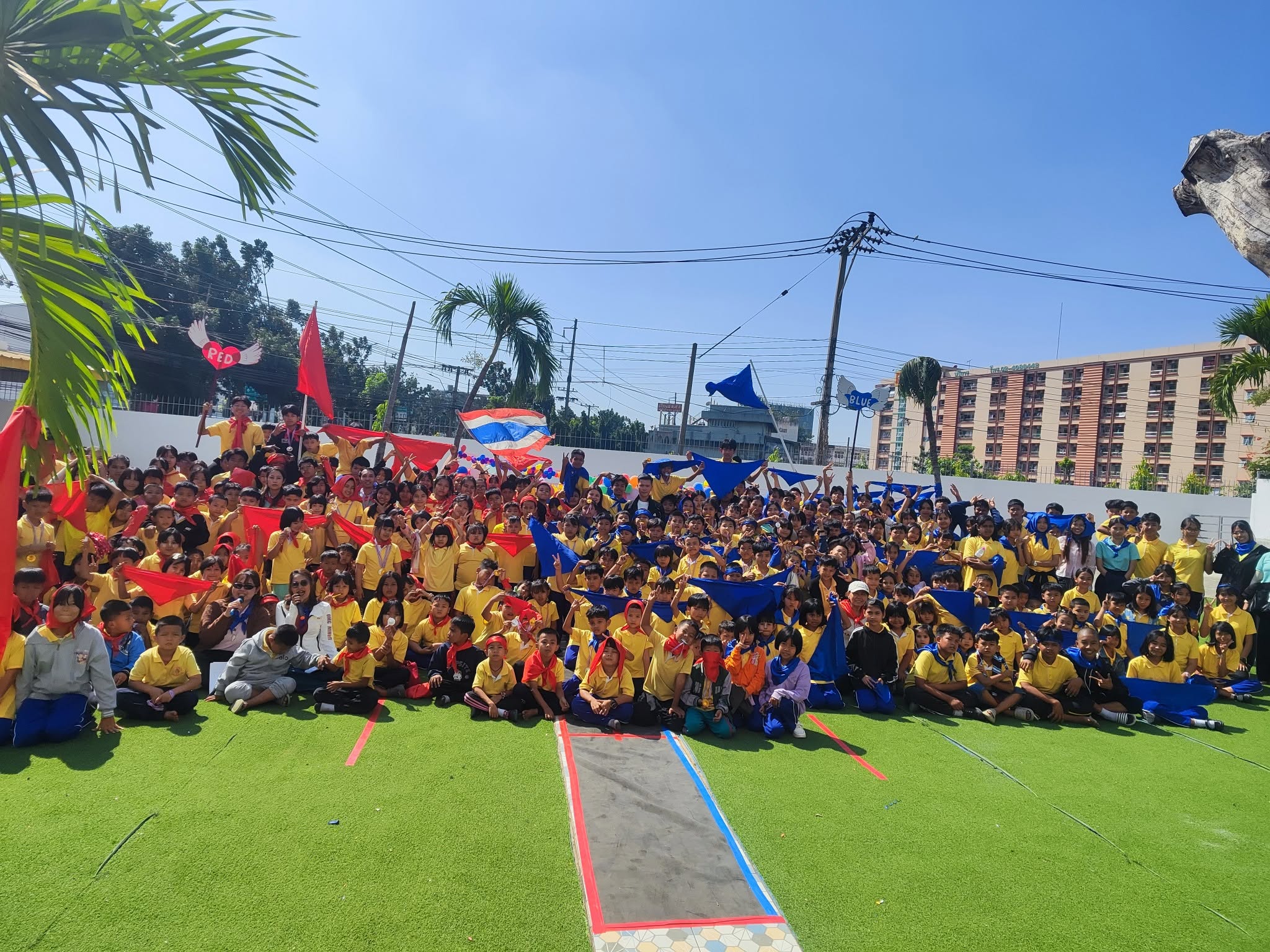 Kong Lah School students gathered outdoors for a school event.